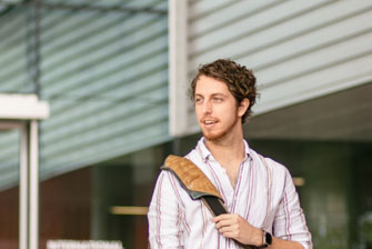 Student happy standing outside