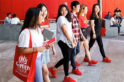 Students walking outside campus red shoes